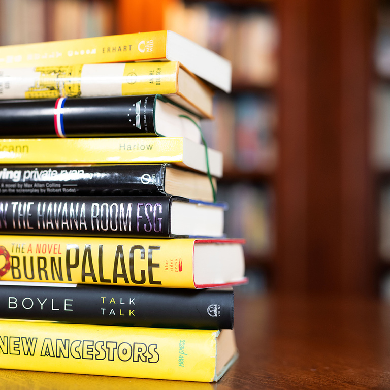 black and gold book stack